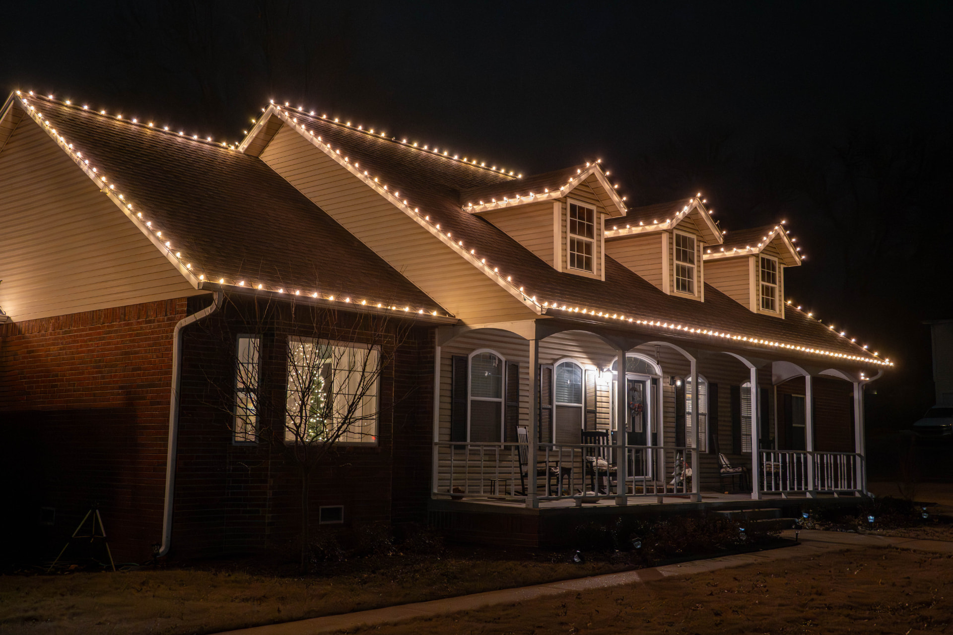 Long roofline traced with warm white holiday lights